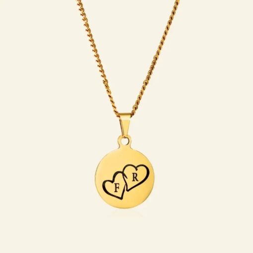 Ketting met hartjes goud kleurig Titanium hanger met Initialen 2 hartjes